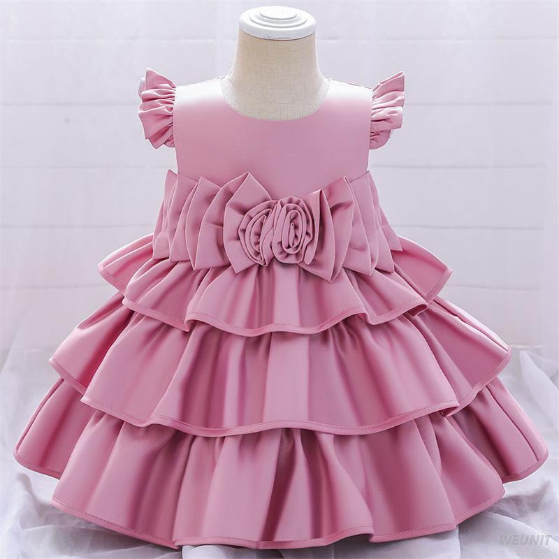 Vestido de ni&ntilde;a de flores de raso con elegancia dorada con lazo en la espalda