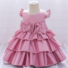 Vestido de ni&ntilde;a de flores de raso con elegancia dorada con lazo en la espalda