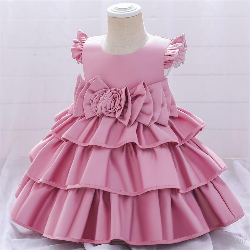 Vestido de ni&ntilde;a de flores de raso con elegancia dorada con lazo en la espalda