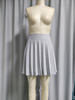 Minifalda plisada brillante para mujer