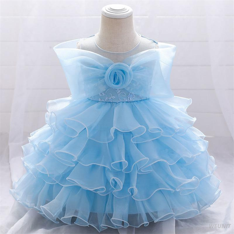 Vestido de ni&ntilde;a de flores de raso con elegancia dorada con lazo en la espalda