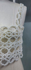 Exquisito top corto de crochet con bordado de perlas